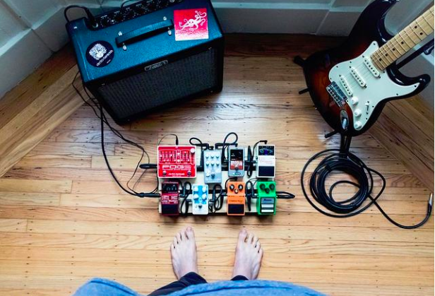 guitar pedalboard and amp